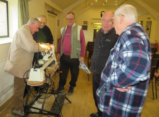 New and old members engrossed in what Keith is doing